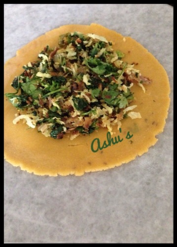 Make the puris and place the coriander filling.